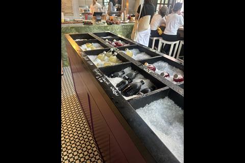 Cold drinks are displayed on ice at the store